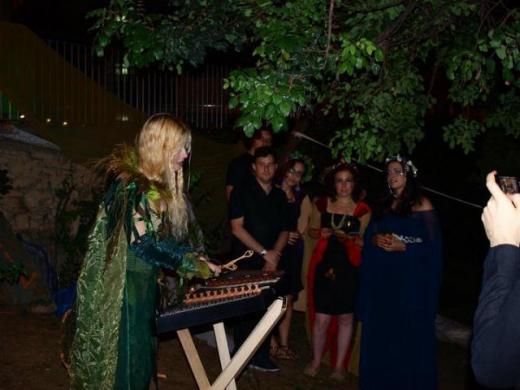 Priscilla Hernandez playing hammered dulcimer